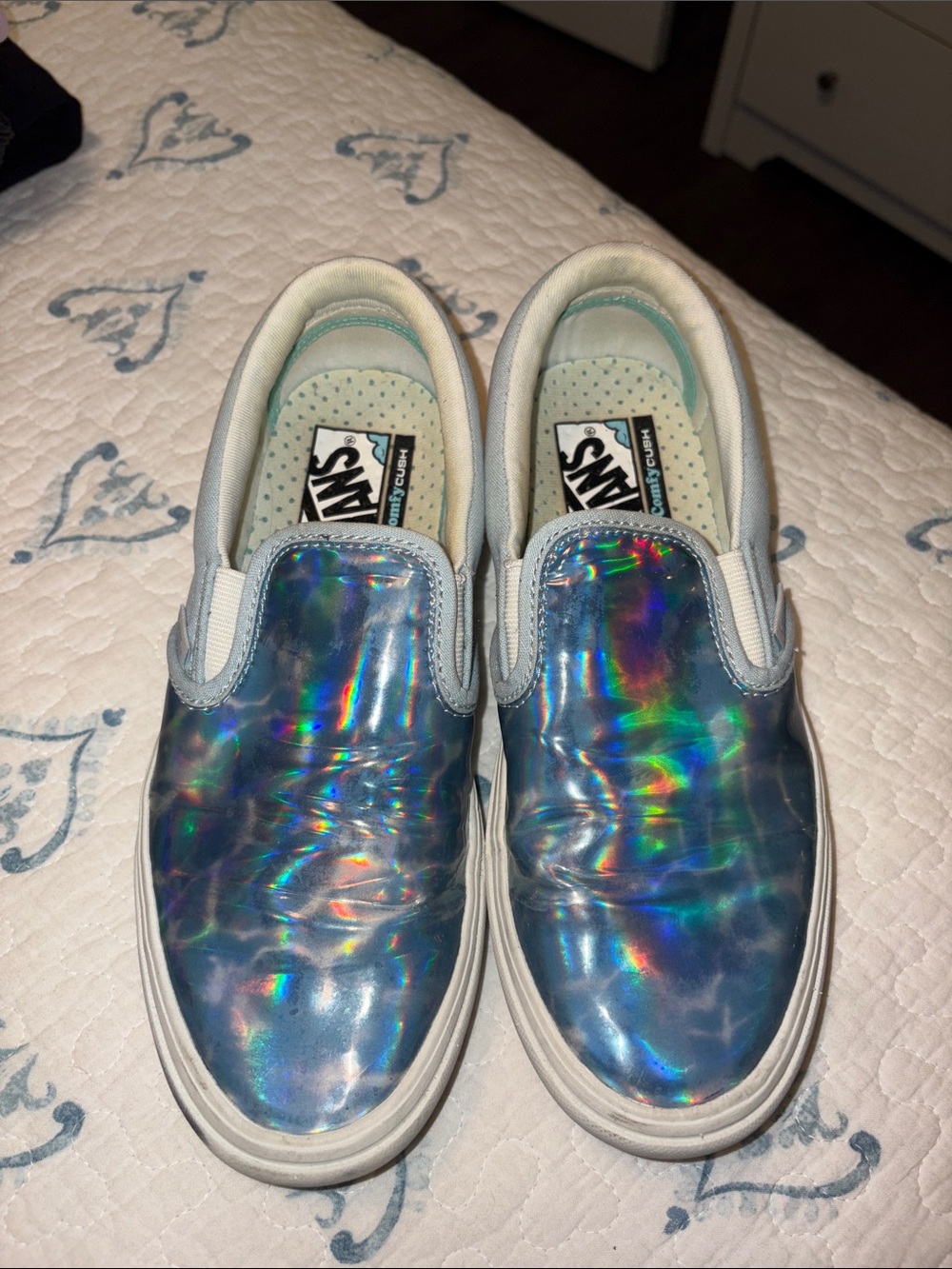 Vans women’s Holographic Slip-On Sneakers in Blue